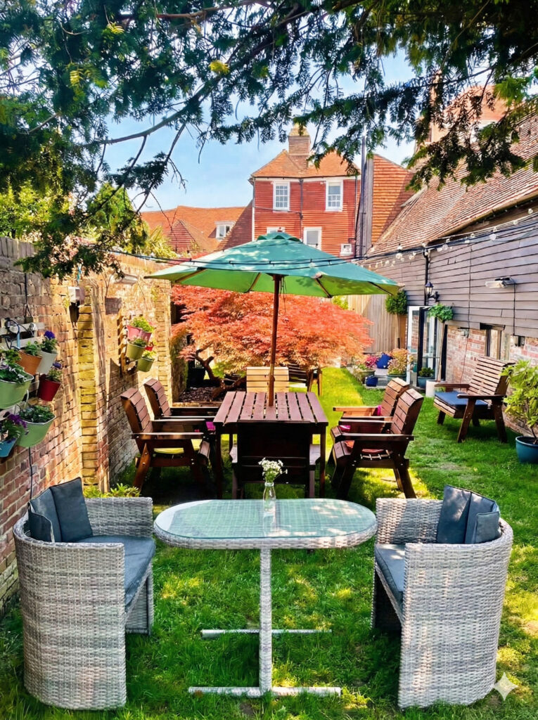 Garden seating with parasol at Thai Orchid Battle